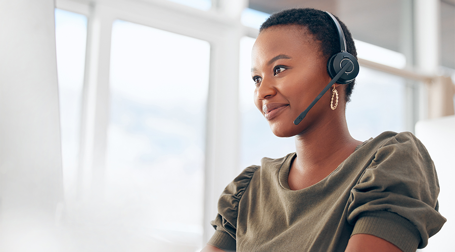 Woman wearing a headset while working in a call center