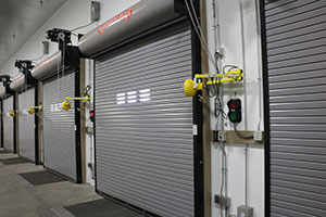 Several garage doors shut in trucking area