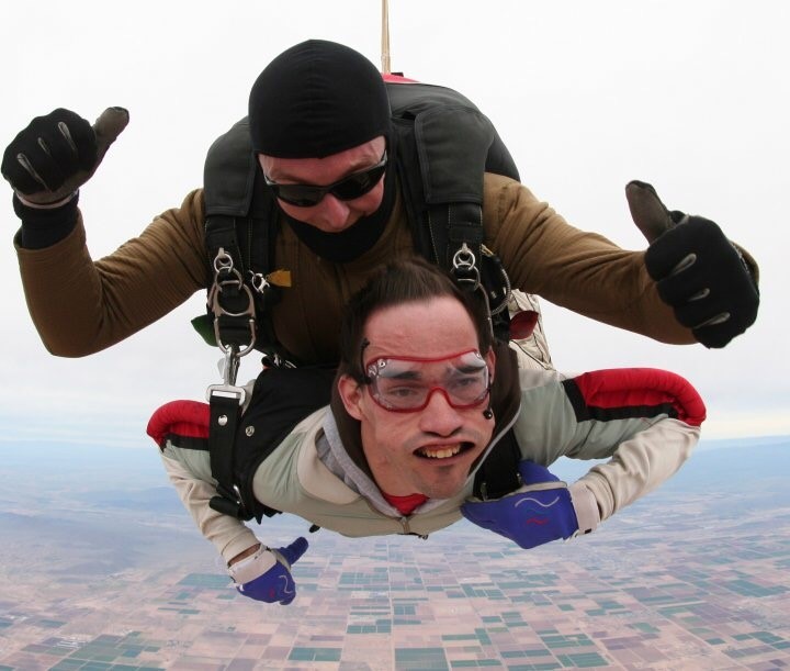 Two men, one an instructor the other a client, free fall in tandem, at 13,000 feet for an introductory sky diving lesson
