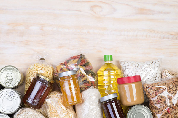 a variety of non-perishable foods, such as jam, peanut butter, pasta, beans, and granola