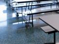 white picnic tables in a cafeteria