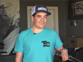 young man wearing a baseball cap and a t-shirt