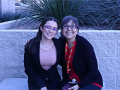 two women sitting on a bench