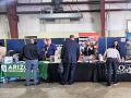 people at booths at a job fair