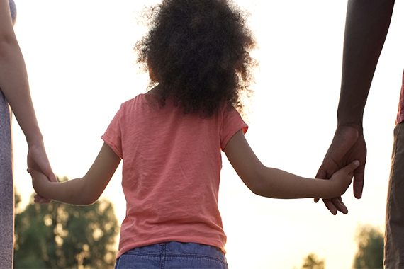 Family child father mother hand holding hands children outdoors household