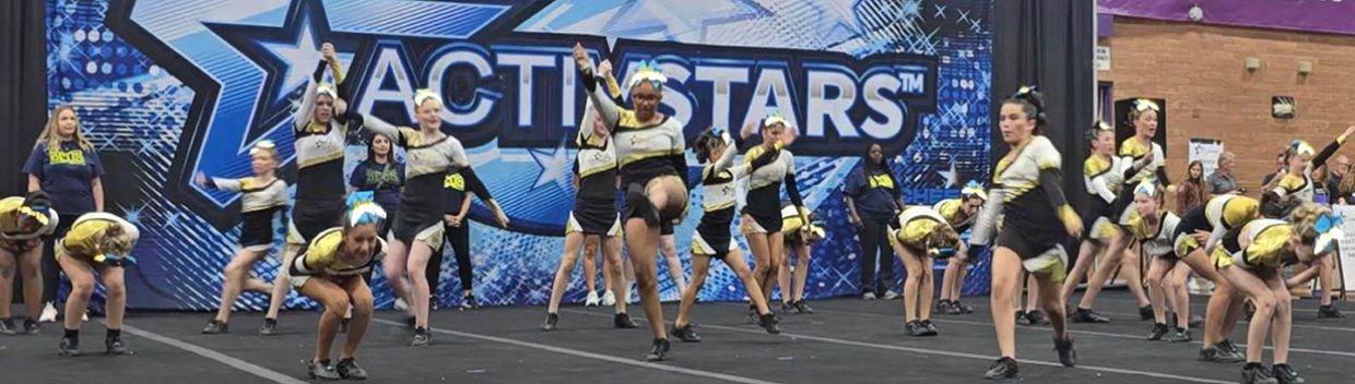 cheer team in one of their acrobatic routines