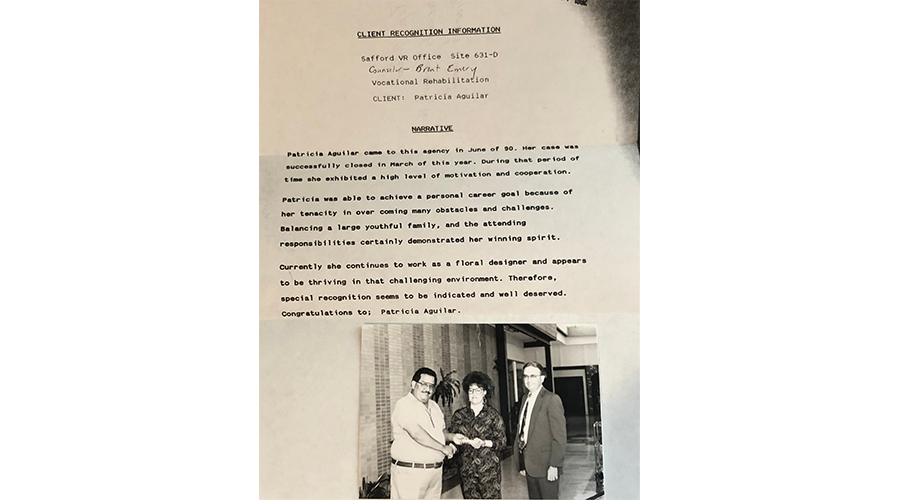 old document with photo of two businessmen and a businesswoman