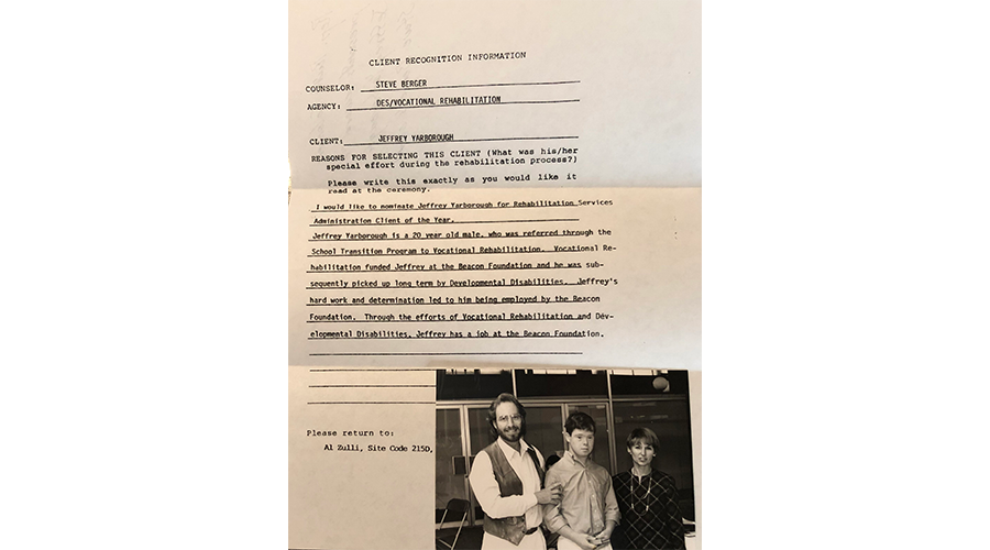 an old document with a photo of a young man standing between a man and woman
