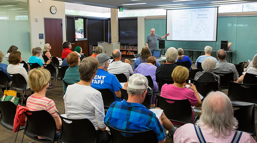 A group of older adults attending a presentation.