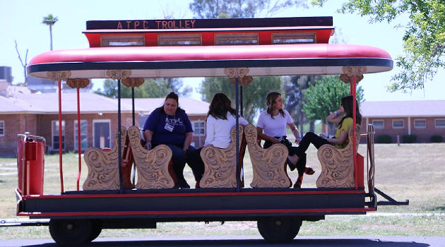 people riding in a trolley