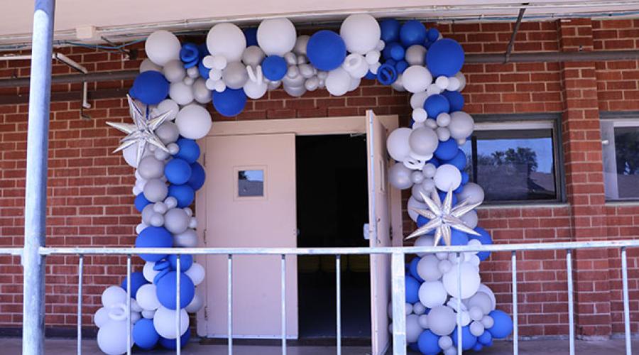 building entrance decorated with a balloon arch 