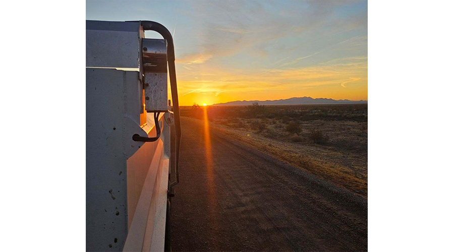 A view of the sunset while at his new truck driving job