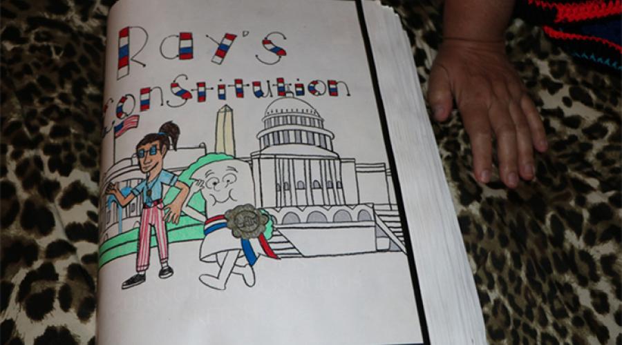 A drawing of cartoon figures and the White House; the words " Ray's Constitution" display at the top