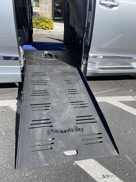 a wheelchair ramp on a silver van